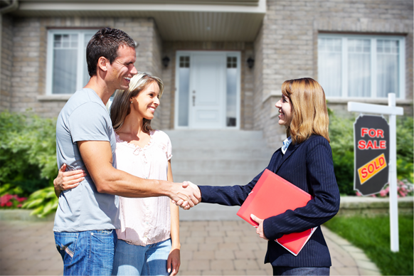 Man and woman shaking hands with an insurance agent