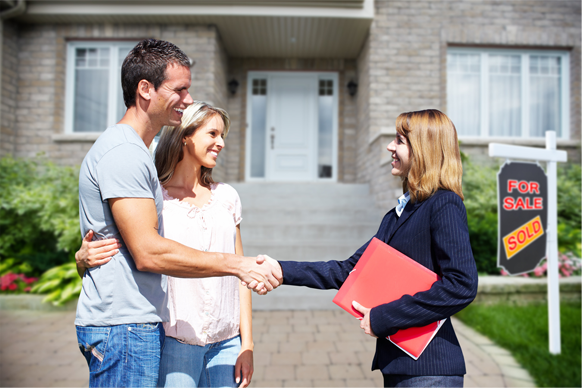 Husband and wife shaking hands with an insurance agent